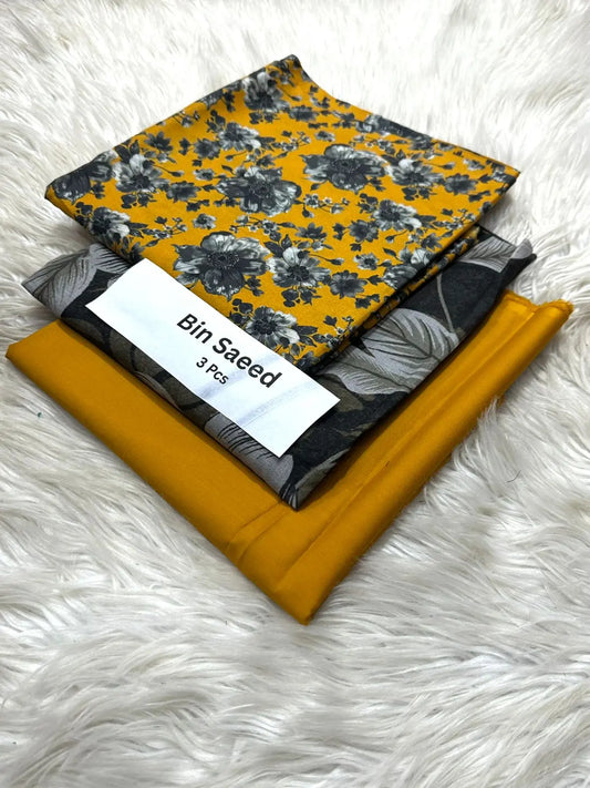 Bin Saeed 3-Piece Lawn Suit – Mustard with Black Floral Print Khoobsurat